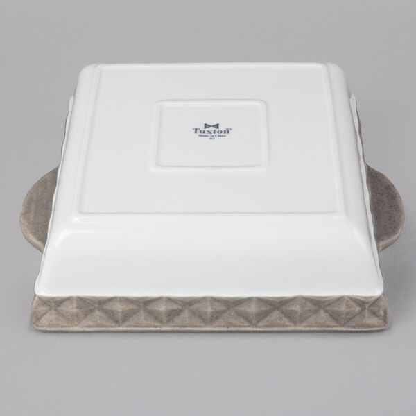 a white rectangular object with blue text