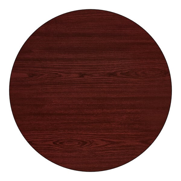 A round, reversible table top with a cherry wood finish, designed for standard height tables and paired with a 22" x 22" cast iron base.