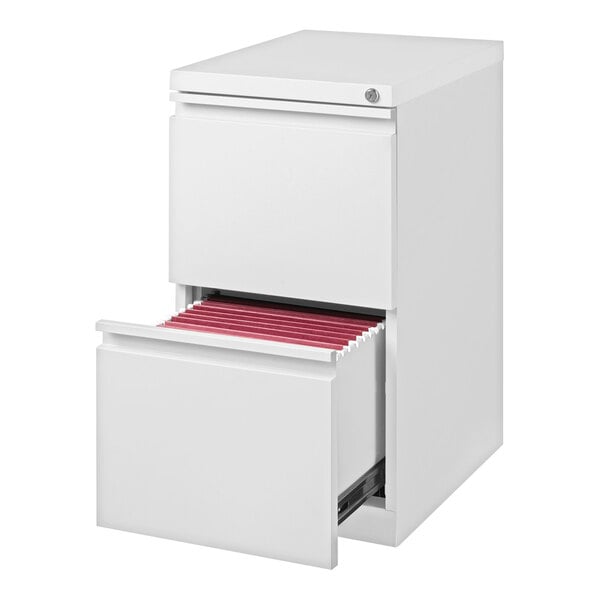 A white two-drawer file cabinet with the bottom drawer open, revealing red hanging file folders inside.