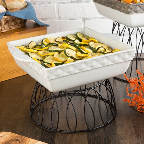 a white dish with food in it