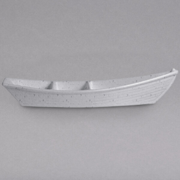 A white G.E.T. Enterprises marble white granite resin-coated aluminum boat with dividers.