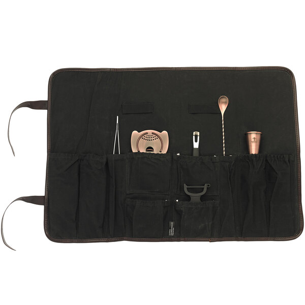 An antique copper Barfly cocktail kit in a black bag with tools inside.