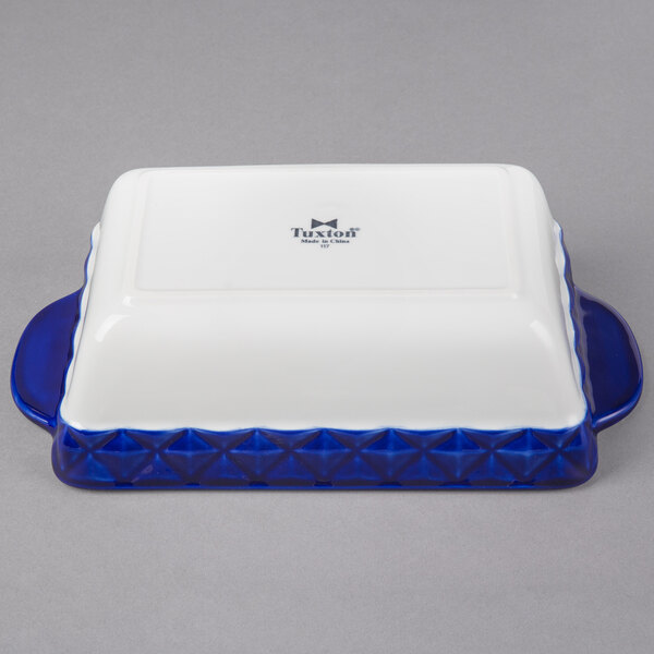 A white rectangular casserole dish with cobalt blue accents.