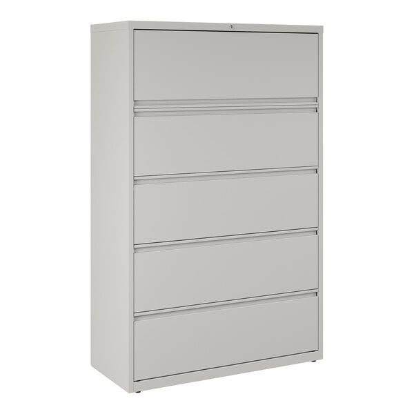 A gray five-drawer lateral file cabinet with roll out binder storage.