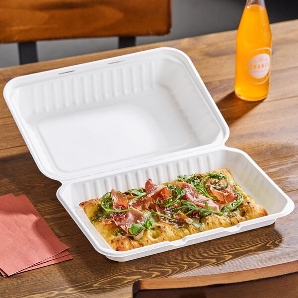A white plant fiber take-out container with one compartment, shown holding a slice of pizza.