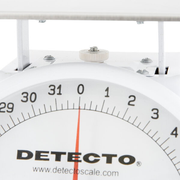 A Cardinal Detecto PT-2R portion scale with a white background and a red rotating dial.