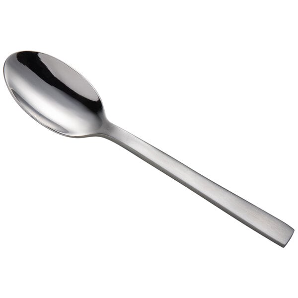 a silver spoon on a white background