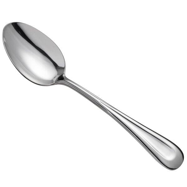 A Oneida Acclivity stainless steel serving spoon with a silver handle and spoon.