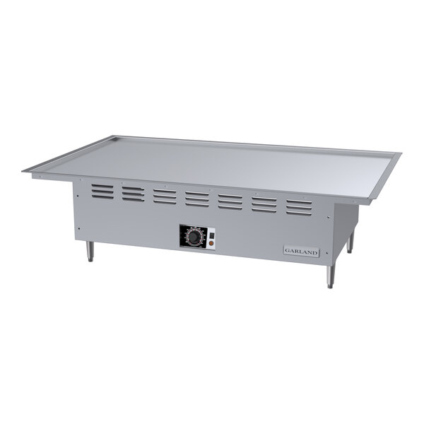 A stainless steel electric drop-in teppanyaki griddle with a flat cooking surface and control panel.