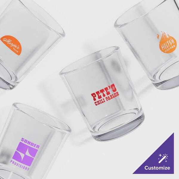A group of Acopa customizable shot glasses on a white background.