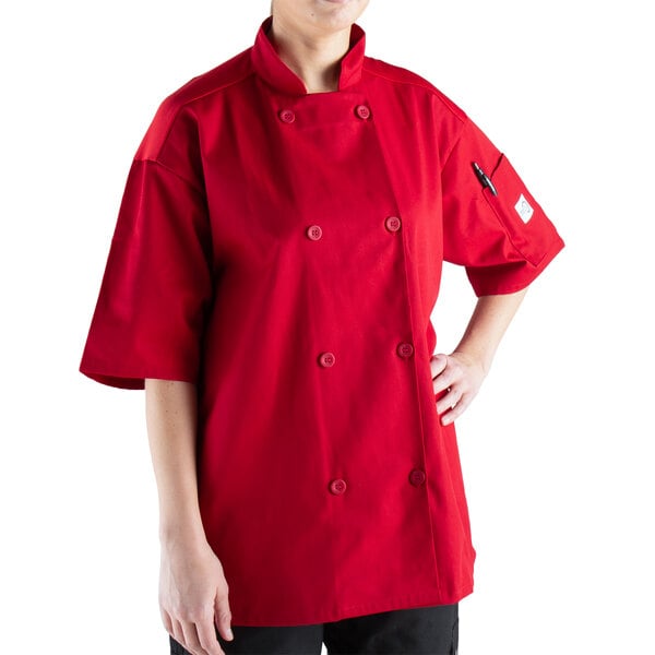 a woman wearing a red chef coat