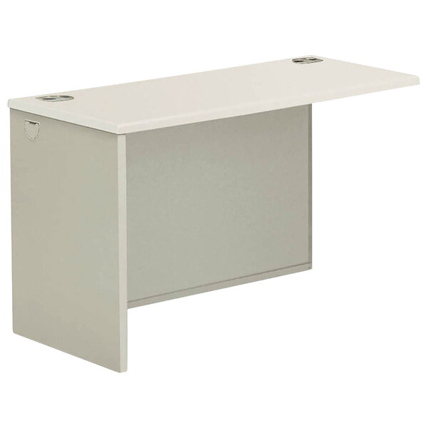 A white desk with a gray top and a gray base.