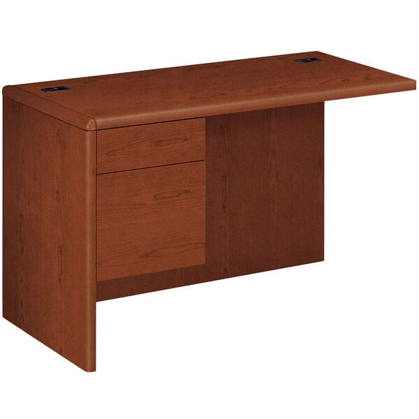 A brown HON 10700 Series "L" Left Pedestal Workstation Return on a table.
