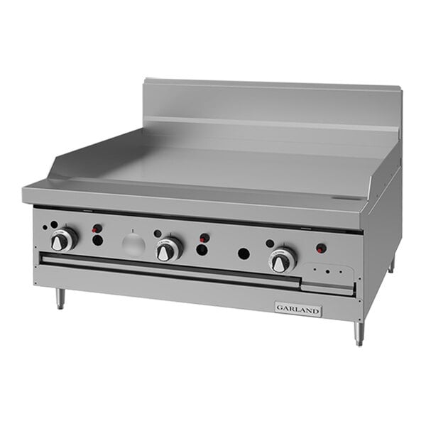 A commercial stainless steel natural gas griddle range with control knobs and a backsplash.