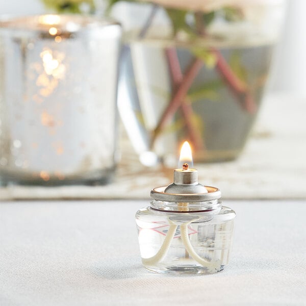 A Leola Liquid Paraffin Fuel Cartridge with a flame inside on a table.