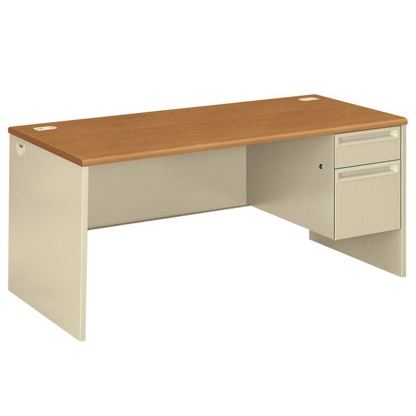 A HON 38000 Series single pedestal desk in harvest/puddy laminate on a white background.