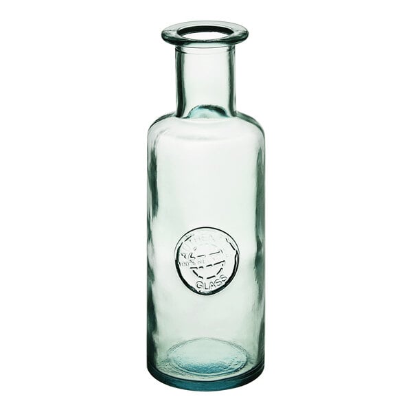 A clear glass carafe with a logo on it.