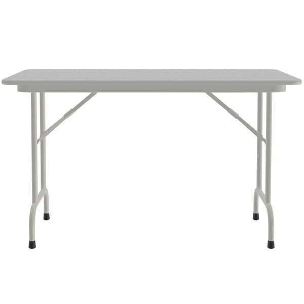 a white rectangular table with legs