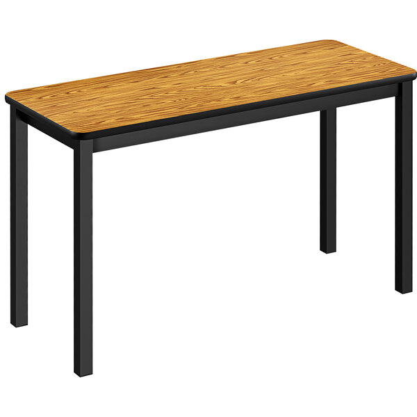 A Correll medium oak lab table with black legs.