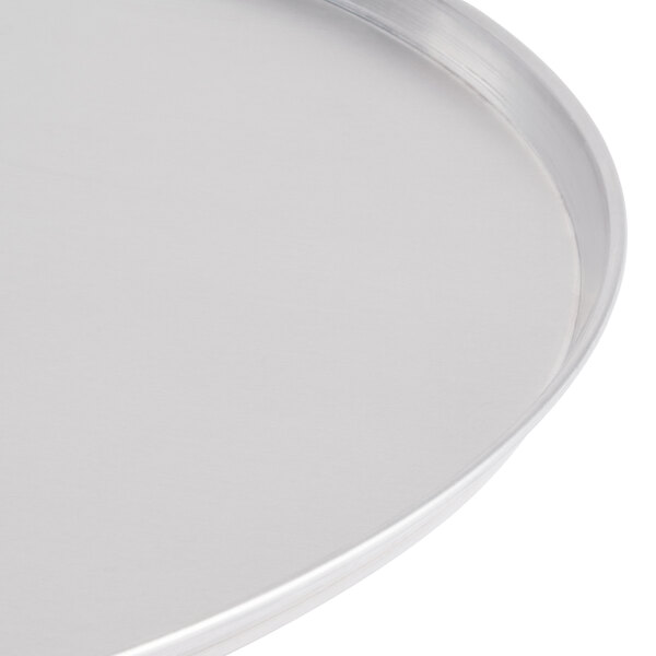 An American Metalcraft aluminum pizza pan with a white background.