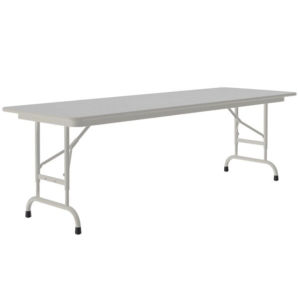 A white rectangular table with black legs.