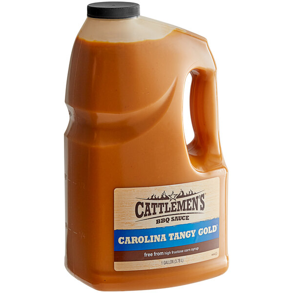 A French's jug of Cattlemen's Carolina Tangy Gold BBQ sauce on a table.