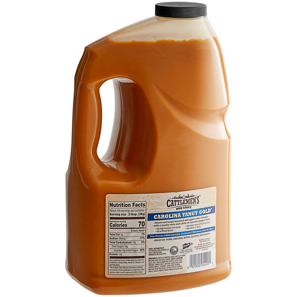 A gallon jug of French's Cattlemen's Carolina Tangy Gold BBQ Sauce with a yellow label.