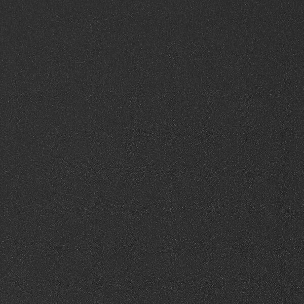 A black surface with small white specks.