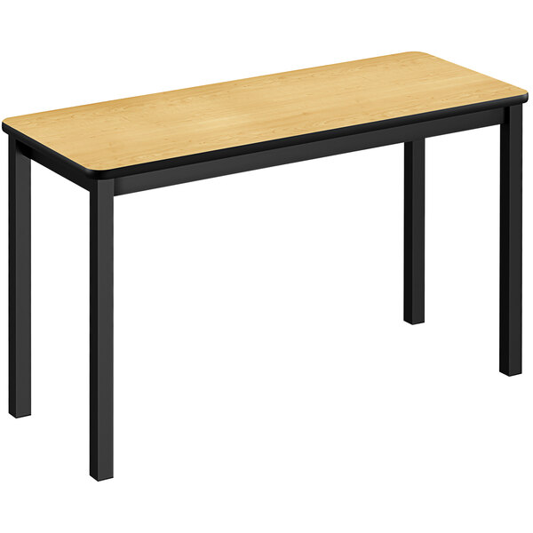 A Correll lab table with black legs and a wood top.