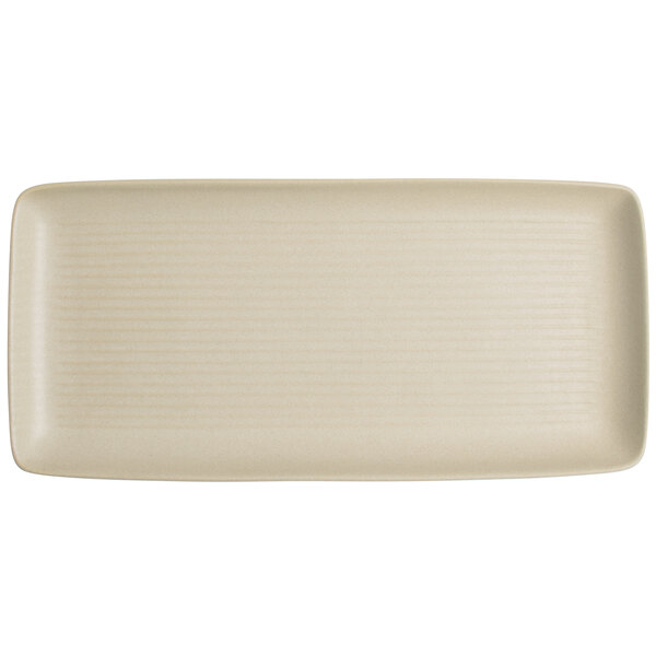 A rectangular white Tuxton China tray with a stripe pattern.