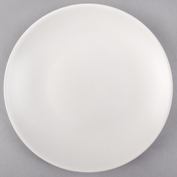 A Tuxton TuxTrendz white china plate with a white rim.