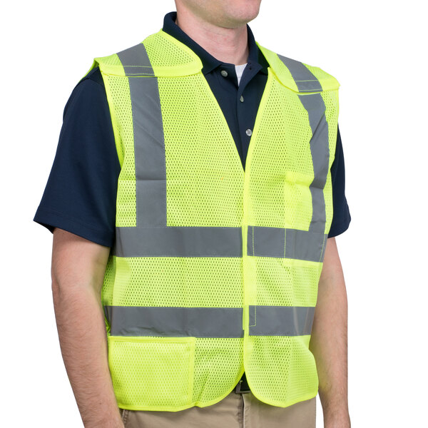 A man wearing a Cordova lime high visibility safety vest.