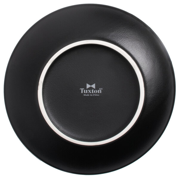 A Tuxton TuxTrendz black china plate with a white border.