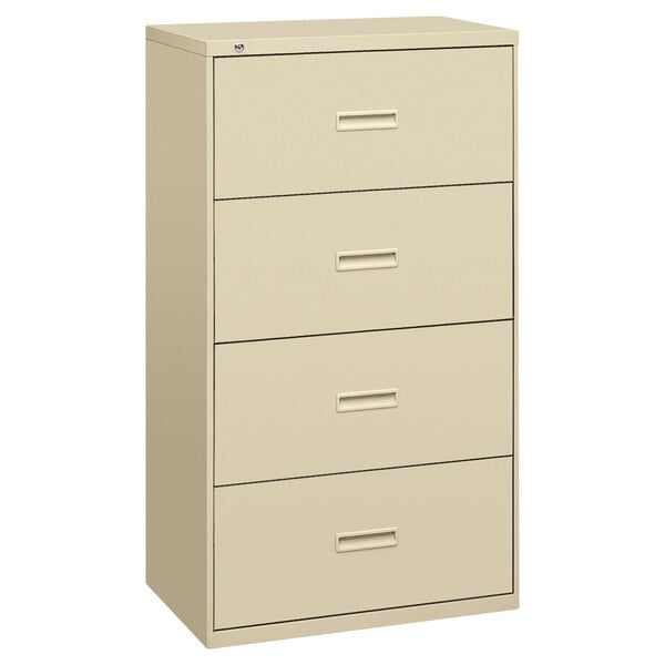 A tan file cabinet with four drawers.