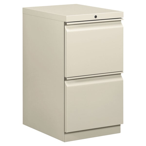 A light gray HON two drawer mobile pedestal file cabinet.