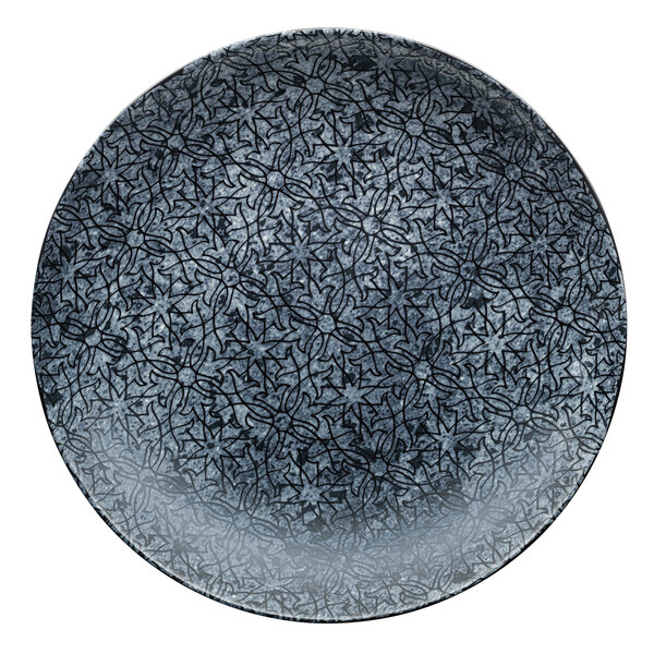 A white Schonwald porcelain deep coupe plate with a black pattern.