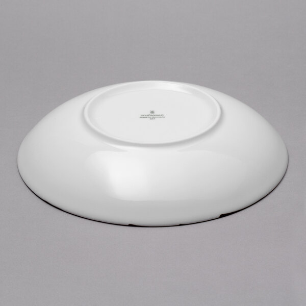 A Schonwald Shabby Chic round porcelain deep coupe plate with stone ornaments on the rim.