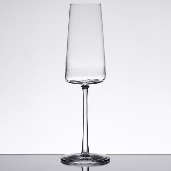 A close up of a Stolzle flute wine glass on a table.