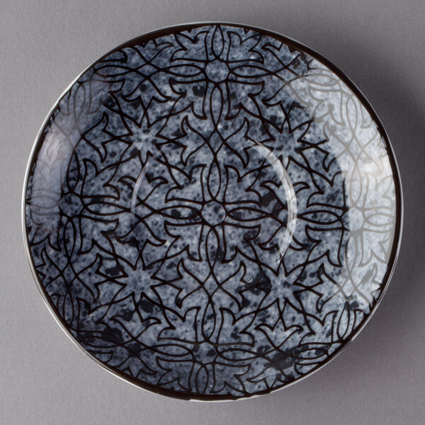 A Schonwald round porcelain saucer with a pattern on it.