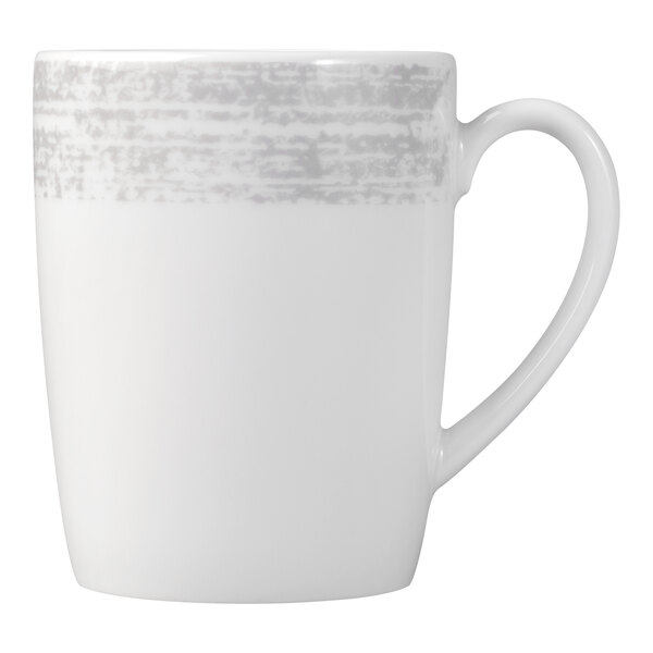 A white mug with a handle and a textured gray band near the rim.