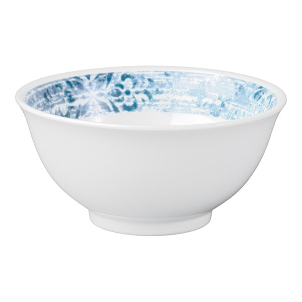 A white porcelain bowl with a blue ornamental pattern on the inner rim.