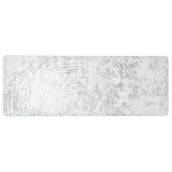 A rectangular white porcelain platter with a grey circular design on the surface.