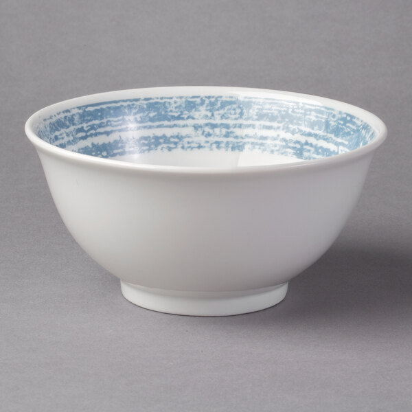 A white porcelain bowl with blue stripes.