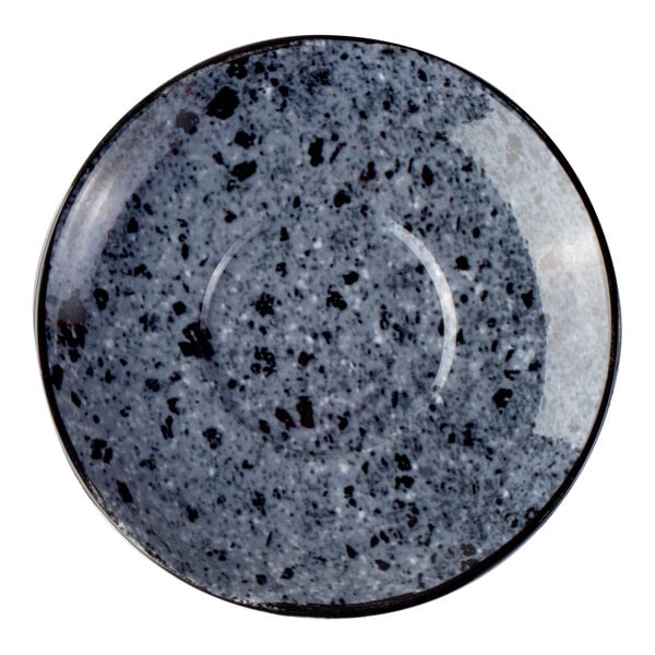 A round saucer with a speckled, stone-like gray and black pattern.