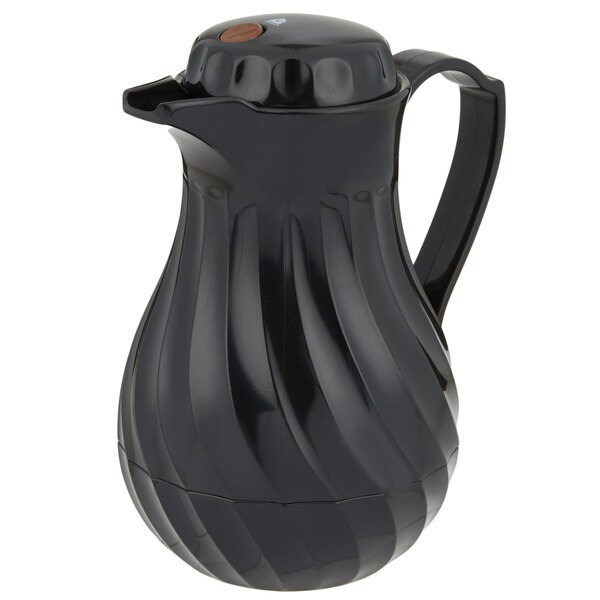 a black pitcher with a handle