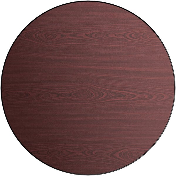 a circular wood surface with a black border