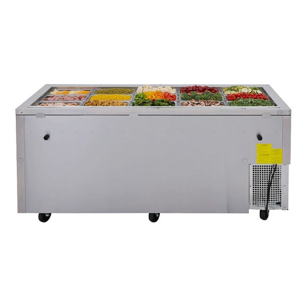 A Turbo Air stainless steel refrigerated buffet display table with a variety of food in it.