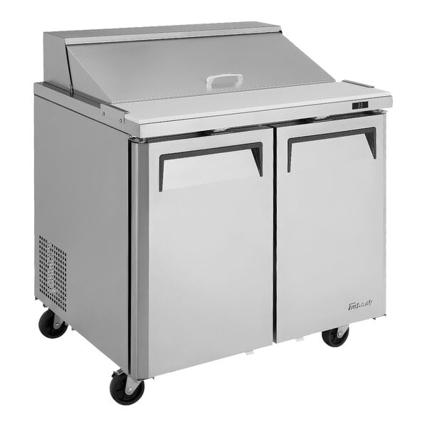 A Turbo Air stainless steel refrigerated sandwich prep table with two doors.