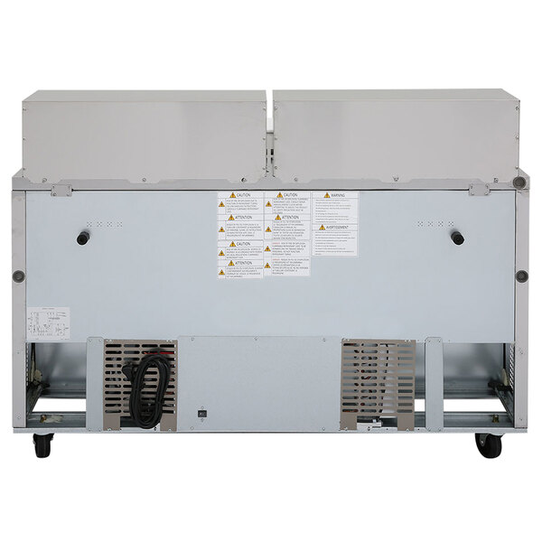 The back of a Turbo Air stainless steel refrigerated sandwich prep table with two doors.
