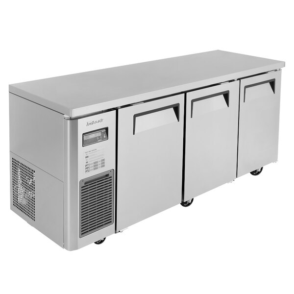 A stainless steel Turbo Air J Series undercounter refrigerator with three doors and two drawers.